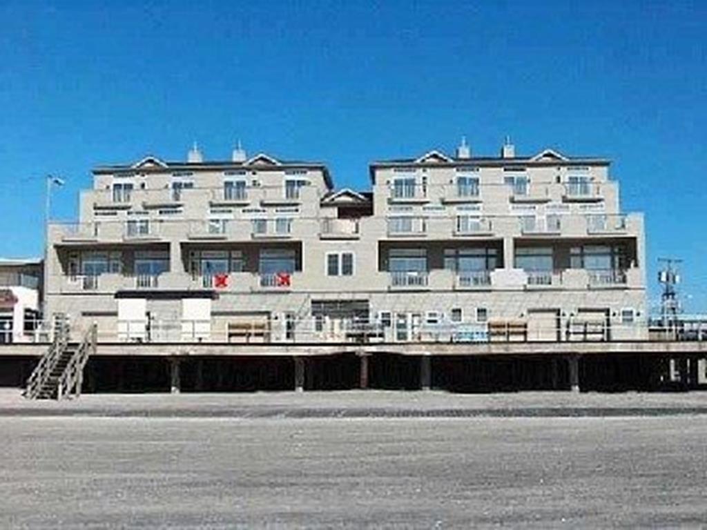 1600 BOARDWALK #203 - NORTH WILDWOOD BOARDWALK & BEACHFRONT SUMMER VACTION RENTALS - Absolutely the most Magnificent panoramic Beach, Ocean and Sunrise views you'll see!!! 4 Bedroom 3 Bath Condominium located directly on the Boardwalk in North Wildwood. In addition to the location and views this complex offers an elevator, 2 car garage parking and private decks to take in all there is to enjoy at the shore. Home is fully equipped with a full kitchen, central HVAC, High Speed Internet/WiFi and private washer and dryer. Sleeps 10; 3 Queens, 2 Singles, 1 Queen Sofa Bed. North Wildwood Rentals, Wildwood Rentals, Wildwood Crest Rentals and Diamond Beach Rentals in all price ranges for weekly, monthly, seasonal and weekend vacation rentals plus Wildwood real estate sales of homes, condos, vacation and investment properties in and around Wildwood New Jersey. We offer over 400 properties plus exclusive vacation homes so you can book the shore rental of your choice online and guarantee your vacation at the Shore. Rent with confidence at Island Realty Group! Visit www.wildwoodrents.com to book online or call our office at 609.522.4999. Our office at 1701 New Jersey Avenue in North Wildwood is open 7 days a week!