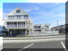 2207 SURF AVENUE  BAYBERRY CONDOS #102 - NORTH WILDWOOD BEACHBLOCK SUMMER VACATION RENTALS with POOLS at WILDWOODRENTS.COM managed by ISLAND REALTY GROUP  - Welcome to your perfect beachside getaway in North Wildwood! This charming property is ideal for a family of up to 6 guests, offering 2 bedrooms and 1 full bathroom for your comfort and convenience. As you step inside, you'll find a cozy living space with modern furnishings and a welcoming atmosphere. The living room features a comfortable sofa bed that can accommodate 2l guests, along with a Smart TV for your entertainment needs. The fully equipped kitchen, complete with a dishwasher, microwave, coffee maker, toaster, blender, stove, oven, and full-size refrigerator. Whip up delicious meals and snacks to enjoy at the dining table or out on the deck with deck furniture and a shared BBQ gas grill. When it's time to rest, retreat to one of the two bedrooms, offering a queen bed and two single beds, along with mattress pads, pillows, and blankets for a restful night's sleep. With high-speed internet and wireless LAN available, you can stay connected throughout your stay. Pool, outside shower, beach block! During your visit, take advantage of the property's amenities, including central AC, standard fans, a washer and dryer, shared washer/dryer, parking for one vehicle, and access to the outdoor pool and association pool. After a day at the beach, rinse off in the shared outside shower before relaxing on the balcony or open/covered porch. Please note that this property does not allow pets and linens are not provided, so be sure to bring your own. Cleaning is included in the rate for your convenience. Don't miss out on this fantastic opportunity to experience the best of North Wildwood! Book your stay today and make unforgettable memories at this beachside retreat. - North Wildwood Rentals, Wildwood Rentals, Wildwood Crest Rentals and Diamond Beach Rentals in all price ranges for weekly, monthly, seasonal and weekend vacation rentals plus Wildwood real estate sales of homes, condos, vacation and investment properties in and around Wildwood New Jersey. We offer over 400 properties plus exclusive vacation homes so you can book the shore rental of your choice online and guarantee your vacation at the Shore. Rent with confidence at Island Realty Group! Visit www.wildwoodrents.com to book online or call our office at 609.522.4999. Our office at 1701 New Jersey Avenue in North Wildwood is open 7 days a week! 