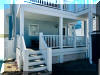 414 EAST 17TH AVENUE  UNIT 1 - NORTH WILDWOOD SUMMER VACATION RENTALS at WILDWOODRENTS.COM managed by ISLAND REALTY GROUP - Welcome to your perfect beachside getaway in North Wildwood! This charming property is ideal for a family of up to 7 guests, offering 2 bedrooms and 2 full bathrooms for your comfort and convenience. As you step inside, you'll find a cozy and well-appointed space featuring a variety of sleeping arrangements including a Queen bed, full/twin bunk, and double Sofa bed,. The property is fully furnished and equipped with modern amenities to ensure a relaxing stay. The kitchen is a chef's dream with a dishwasher, microwave, disposal, toaster, blender, stove, full-size refrigerator, oven, Keurig coffee maker, and all the necessary cookware and dinnerware. Whether you're preparing a quick snack or a gourmet meal, you'll find everything you need right at your fingertips. Stay cool and comfortable with central AC and ceiling fans throughout the property. Entertainment options abound with cable TV, high-speed internet, and 2 Smart TVs with streaming services for your viewing pleasure. After a fun day at the beach, rinse off in the convenient outdoor shower and relax on the deck with deck furniture, enjoying the fresh sea breeze. Beach equipment including 4 beach chairs is provided for your enjoyment. Parking is a breeze with 2 designated parking spaces available. This property is smoke-free and does not allow pets. Tenants bring their own linens. A washer/dryer is available for your convenience. Experience the best of North Wildwood from this fantastic beachside retreat. Book your stay today and create unforgettable memories with your loved ones in this beautiful coastal paradise! - North Wildwood Rentals, Wildwood Rentals, Wildwood Crest Rentals and Diamond Beach Rentals in all price ranges for weekly, monthly, seasonal and weekend vacation rentals plus Wildwood real estate sales of homes, condos, vacation and investment properties in and around Wildwood New Jersey. We offer over 400 properties plus exclusive vacation homes so you can book the shore rental of your choice online and guarantee your vacation at the Shore. Rent with confidence at Island Realty Group! Visit www.wildwoodrents.com to book online or call our office at 609.522.4999. Our office at 1701 New Jersey Avenue in North Wildwood is open 7 days a week!