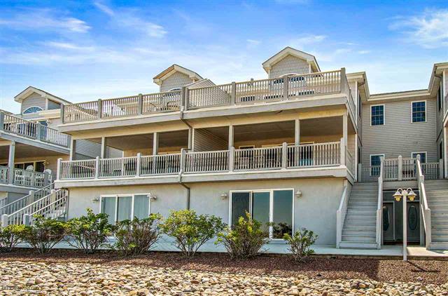100 EAST RALEIGH AVENUE - HARBOR VISTA 102 - DIAMOND BEACH SUMMER VACATION RENTALS WITH POOLS - Three bedroom, three bath vacation home with two living areas located in Diamond Beach. Home offers a full kitchen with range, fridge, dishwasher, disposal, microwave, toaster, blender, ice maker, and coffee maker. Sleeps 8; king, queen, 2 twin and queen sleep sofa. Amenities include pool, outside shower, balcony, 2 car garage parking, wifi, central a/c, washer/dryer. Wildwood Crest Rentals, North Wildwood Rentals, Wildwood Rentals and Diamond Beach Rentals in all price ranges for weekly, monthly, seasonal and weekend vacation rentals plus Wildwood real estate sales of homes, condos, vacation and investment properties in and around Wildwood New Jersey. We offer over 400 properties plus exclusive vacation homes so you can book the shore rental of your choice online and guarantee your vacation at the Shore. Rent with confidence at Island Realty Group! Visit www.wildwoodrents.com to book online or call our office at 609.522.4999. Our office at 1701 New Jersey Avenue in North Wildwood is open 7 days a week!