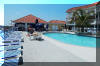 106 WEST SPRUCE AVENUE  CHAMPAGNE ISLAND #203 - NORTH WILDWOOD SUMMER VACATION RENTALS with POOLS at WILDWOODRENTS.COM managed by ISLAND REALTY GROUP - Welcome to your perfect vacation getaway in North Wildwood Beach Side! This stunning property is ideal for a family of up to 6 people, offering 2 bedrooms and 2 full bathrooms for your comfort and convenience. As you step inside, you'll be greeted by a beautifully furnished living space featuring 2 Queen beds and a cozy Queen sofa bed, ensuring a good night's sleep for everyone. The modern kitchen is fully equipped with all the essentials, including a dishwasher, microwave, toaster, blender, stove, and full-size refrigerator. Whether you're whipping up a quick breakfast or preparing a gourmet dinner, you'll find everything you need right at your fingertips. Relax and unwind in the spacious living room with cable TV and high-speed internet, or step outside to enjoy the fresh air on one of the two decks with deck furniture. Take a dip in the outdoor pool or soak up the sun on the balcony while admiring the beautiful views of the surrounding area. Tiki Bar located at the pool! This property also offers convenient amenities such as central AC, a vacuum cleaner, parking for one vehicle, an elevator to the ground floor, and a storage area for your belongings. For your convenience, this property comes fully furnished, but please remember to bring your own linens. Additional amenities include wireless internet access, Keurig coffee maker, mattress pads, pillows, pots and pans, silverware, dinnerware, cooking utensils, and three smart TVs for your entertainment. Don't miss out on the opportunity to experience the ultimate vacation in North Wildwood Beach Side. Book your stay now and create unforgettable memories in this beautiful rental property! North Wildwood Rentals, Wildwood Rentals, Wildwood Crest Rentals and Diamond Beach Rentals in all price ranges for weekly, monthly, seasonal and weekend vacation rentals plus Wildwood real estate sales of homes, condos, vacation and investment properties in and around Wildwood New Jersey. We offer over 400 properties plus exclusive vacation homes so you can book the shore rental of your choice online and guarantee your vacation at the Shore. Rent with confidence at Island Realty Group! Visit www.wildwoodrents.com to book online or call our office at 609.522.4999. Our office at 1701 New Jersey Avenue in North Wildwood is open 7 days a week!