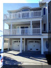 108 EAST 1ST AVENUE - North Wildwood Summer Rental - ENJOY YOUR VACATION WITH YOUR EXTENDED FAMILY in this incredible four bed/two bath first floor condo which very comfortably sleeps 10. Located on East First Avenue with only TWO SHORT BLOCKS TO THE BEACH. Various restaurants, pubs, shopping, miniature golf and water activities within close walking distance. Walk or take the bike trail to Wildwood s Boardwalk. Perfect for entertaining. Excellent accommodations in oversized bedrooms (1-King, 1-Queen, 4-Full/Double Beds). Features upgrades throughout including: flat screen televisions with cable service in all rooms, granite counters in kitchen, tile floors in kitchen and bathrooms, fireplace, beautiful furnishings with tropical decor, spacious rooms, oversized deck, full size washer and dryer, dishwasher, stove with oven, microwave oven, outside shower, parking for 3 cars(2-garage,1-driveway). BRING YOUR PERSONAL LAPTOP AND STAY CONNECTED WITH FREE WIRELESS INTERNET ACCESS. 