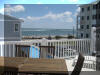 129 WEST SPRUCE AVENUE  INLET CONDOS #2 - NORTH WILDWOOD SUMMER VACATION RENTALS with POOLS at WILDWOODRENTS.COM - Three bedroom, two bath vacation home with view of the inlet! Home offers a full kitchen with range, fridge, dishwasher,  disposal, microwave, coffeemaker and blender. Amenities include central a/c, wifi, pool, balcony, outside shower, storage area, 2 car garage, 1 car driveway. Sleeps 6: 1 Queen, 4 Twins. (full air mattress avail). North Wildwood Rentals, Wildwood Rentals, Wildwood Crest Rentals and Diamond Beach Rentals in all price ranges for weekly, monthly, seasonal and weekend vacation rentals plus Wildwood real estate sales of homes, condos, vacation and investment properties in and around Wildwood New Jersey. We offer over 400 properties plus exclusive vacation homes so you can book the shore rental of your choice online and guarantee your vacation at the Shore. Rent with confidence at Island Realty Group! Visit www.wildwoodrents.com to book online or call our office at 609.522.4999. Our office at 1701 New Jersey Avenue in North Wildwood is open 7 days a week!