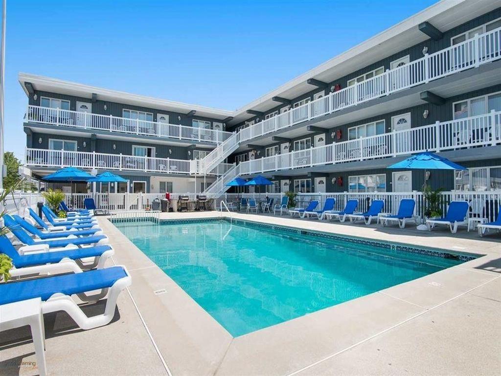 1309 OCEAN AVENUE  ROYAL SANDS #127 - NORTH WILDWOOD BEACHBLOCK SUMMER VACATION RENTALS with POOLS at WILDWOODRENTS.COM managed by ISLAND REALTY GROUP - Welcome to your beachside escape in North Wildwood! This cozy 1-bedroom, 1-bathroom rental property is the perfect vacation spot for up to 4 guests. As you step inside, you'll find a comfortable living space with 2 double beds and a queen sofa bed, ideal for a good night's sleep after a day of fun in the sun. The fully equipped kitchen features all the essentials including a microwave, coffee maker, toaster, and blender. Central AC keeps the space cool, while the smart TV and high-speed internet provide entertainment options for a relaxing evening in. Step outside onto the deck or balcony to soak up the sun and enjoy the fresh sea breeze. The outdoor pool is perfect for a refreshing dip, and deck furniture allows for lounging and sunbathing. This rental property comes fully furnished, with all the amenities you need for a comfortable stay, including a stove, full-size refrigerator, oven, and kitchen stocked with pots, pans, silverware, and dinnerware. With blankets, pillows, and wireless LAN provided, all you need to bring are your own linens. Additionally, the property features a smart TV with streaming services for your entertainment needs. Located in North Wildwood Beach Side, this rental property is close to the beach and attractions, making it the perfect home base for your North Wildwood adventure. Book now for a memorable beach vacation experience! North Wildwood Rentals, Wildwood Rentals, Wildwood Crest Rentals and Diamond Beach Rentals in all price ranges for weekly, monthly, seasonal and weekend vacation rentals plus Wildwood real estate sales of homes, condos, vacation and investment properties in and around Wildwood New Jersey. We offer over 400 properties plus exclusive vacation homes so you can book the shore rental of your choice online and guarantee your vacation at the Shore. Rent with confidence at Island Realty Group! Visit www.wildwoodrents.com to book online or call our office at 609.522.4999. Our office at 1701 New Jersey Avenue in North Wildwood is open 7 days a week!