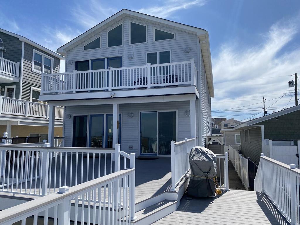 1411 HOFFMAN CANAL - NORTH WILDWOOD BAYFRONT SUMMER VACATION RENTALS at WILDWOODRENTS.COM managed by ISLAND REALTY GROUP, NORTH WILDWOOD REALTORS AND VACATION RENTAL MANAGEMENT - 2 story, bayfront home with 4 bedrooms and 3 baths! Home offers a full kitchen with range, fridge, dishwasher, disposal, microwave, coffee maker, Keurig and blender. Amenities include central a/c, wifi, multiple bay front balconies/decks, outside shower, gas bbq, boat slip, 3 car off street parking. Sleeps 14. Master: king, 2nd:queen. North Wildwood Rentals, Wildwood Rentals, Wildwood Crest Rentals and Diamond Beach Rentals in all price ranges for weekly, monthly, seasonal and weekend vacation rentals plus Wildwood real estate sales of homes, condos, vacation and investment properties in and around Wildwood New Jersey. We offer over 400 properties plus exclusive vacation homes so you can book the shore rental of your choice online and guarantee your vacation at the Shore. Rent with confidence at Island Realty Group! Visit www.wildwoodrents.com to book online or call our office at 609.522.4999. Our office at 1701 New Jersey Avenue in North Wildwood is open 7 days a week!