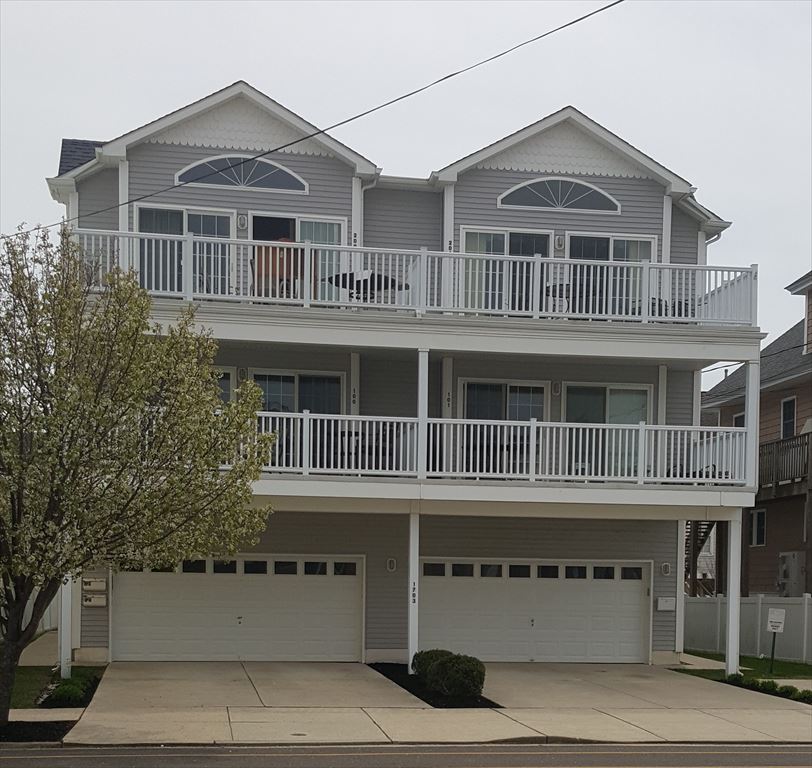 1703 SURF AVENUE, #101 - NORTH WILDWOOD RENTALS - Four bedroom, 3 bath vacation home located 2 blocks from the beach in North Wildwood! Home offers a full kitchen with range, fridge, dishwasher, microwave, icemaker, disposal, coffee maker and toaster. Amenities include: wifi, outside shower, balcony, central a/c, washer and dryer, 2 car off street parking. Sleeps 10; king, 2 full, 2 queen. North Wildwood Rentals, Wildwood Rentals, Wildwood Crest Rentals and Diamond Beach Rentals in all price ranges for weekly, monthly, seasonal and weekend vacation rentals plus Wildwood real estate sales of homes, condos, vacation and investment properties in and around Wildwood New Jersey. We offer over 400 properties plus exclusive vacation homes so you can book the shore rental of your choice online and guarantee your vacation at the Shore. Rent with confidence at Island Realty Group!