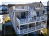 1706 NEW YORK AVENUE  NORTH WILDWOOD TOWNSHOUSE - 5 bedroom, 3 bath townhouse with roof top deck located in North Wildwood. Home offers a full kitchen with range, fridge, dishwasher, disposal, microwave, coffee maker. Amenities include central a/c, washer/dryer, wifi, hot tub, five balconies, outside shower, private fenced yard, gas grill, 2 car off street parking. Sleeps 16; 2 king, 2 queen, 2 double, double futon, and air mattress. North Wildwood Rentals, Wildwood Rentals, Wildwood Crest Rentals and Diamond Beach Rentals in all price ranges for weekly, monthly, seasonal and weekend vacation rentals plus Wildwood real estate sales of homes, condos, vacation and investment properties in and around Wildwood New Jersey. We offer over 400 properties plus exclusive vacation homes so you can book the shore rental of your choice online and guarantee your vacation at the Shore. Rent with confidence at Island Realty Group! Visit www.wildwoodrents.com to book online or call our office at 609.522.4999. Our office at 1701 New Jersey Avenue in North Wildwood is open 7 days a week!