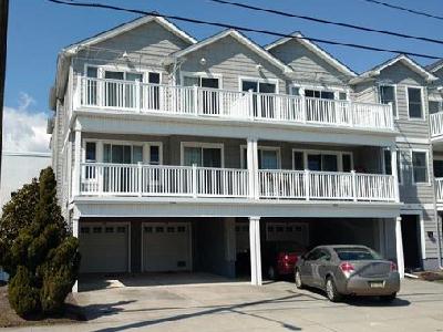 2506 SURF AVENUE – UNIT 100 – NORTH WILDWOOD SUMMER VACATION RENTALS WITH POOLS – Location, Pool and New Owner this Season will all add up to a great family vacation full of memories. Tastefully decorated in a Coastal them this 3 bedroom 2 bath condominium is conveniently located 50ft from Beachblock in North Wildwood. Larger  than your typical condo with well-proportioned bedrooms and an fully-appointed kitchen overlooking the expansive living room, you’ll first notice the upgrades throughout this fine home. Granite counters and vanities, tumbled Travertine backsplashes, glistening floors and a full-width deck perfect for people watching. Each bedroom is uniquely decorated with the Master Bedrooms offering a private bath with double basins and a large walk-in closet. Both baths are outfitted with tubs and sliding doors. Additional amenities include Central HVAC, off-street parking for 2 (1 in Private garage and 1 in Driveway) private in-home laundry with full-sized washer and dryer, Hi-Speed Internet, outside shower and don’t forget the inviting pool. All of this is located within steps to the World-Famous Wildwood Boardwalk, Beach, Morey’s Piers and Sam’s Pizza! Sleeps 9; Guest Bedroom 1: Queen, Guest Bedroom 2: Bunk with 1 Full and 1 Single, Master Bedroom: 1 Queen, 1 Queen Sofa Bed in Living Room. North Wildwood Rentals, Wildwood Rentals, Wildwood Crest Rentals and Diamond Beach Rentals in all price ranges for weekly, monthly, seasonal and weekend vacation rentals plus Wildwood real estate sales of homes, condos, vacation and investment properties in and around Wildwood New Jersey. We offer over 400 properties plus exclusive vacation homes so you can book the shore rental of your choice online and guarantee your vacation at the Shore. Rent with confidence at Island Realty Group! Visit www.wildwoodrents.com to book online or call our office at 609.522.4999. Our office at 1701 New Jersey Avenue in North Wildwood is open 7 days a week!
