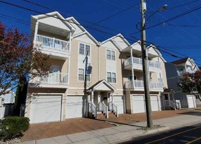 307 EAST POPLAR AVENUE #201 - WILDWOOD SUMMER VACATION RENTALS at WILDWOODRENTS.COM - Located 1.5 blocks to the boardwalk & beach. 4 bedrooms, 2 bath condo, open concept living space with private outdoor balcony. Private parking for 3 cars. Sleeps 12 comfortably. Bedding configuration: 2 queen beds, 4 full beds, 2 twin beds. Living Space: sleeper sofa and 1 folding cot also included. Fully loaded kitchen: refrigerator, stove/oven, microwave, dishwasher, garbage disposal, toaster, coffee maker & Keurig, instapot, pots, pans, eating utensils, plates/cups. In-unit washer & dryer, central A/C, ceiling fans, outdoor shower, and high speed wifi. 4 TVs equipped with Roku for Netflix, Hulu, or Disney+! Beach cart, umbrella, and 4 beach chairs are included in the garage storage closet. Wildwood Rentals, North Wildwood Rentals, Wildwood Crest Rentals and Diamond Beach Rentals in all price ranges for weekly, monthly, seasonal and weekend vacation rentals plus Wildwood real estate sales of homes, condos, vacation and investment properties in and around Wildwood New Jersey. We offer over 400 properties plus exclusive vacation homes so you can book the shore rental of your choice online and guarantee your vacation at the Shore. Rent with confidence at Island Realty Group! Visit www.wildwoodrents.com to book online or call our office at 609.522.4999. Our office at 1701 New Jersey Avenue in North Wildwood is open 7 days a week!