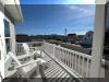 309 WEST WALNUT AVENUE - NORTH WILDWOOD BAYSIDE SUMMER VACATION RENTALS at WILDWOODRENTS.COM managed by ISLAND REALTY GROUP - 4 bedroom, 3 bath vacation home located bayside with water way views and slight ocean view! Large floor plan! Home boasts a family room on the first level with a pool table, large TV, and bar. 2nd floor offers a large fully equipped kitchen, dining, and living room. 2 bedrooms and a 1 bathroom. Third floor has two additional bedrooms and two baths. Three balconies and back yard for outdoor enjoyment! Amenities include central a/c, washer/dryer, wifi, outside shower, and 4 car off street parking. Sleeps 14: king, 3 queen, 2 full/twin bunks, and sleep sofa.  - North Wildwood Rentals, Wildwood Rentals, Wildwood Crest Rentals and Diamond Beach Rentals in all price ranges for weekly, monthly, seasonal and weekend vacation rentals plus Wildwood real estate sales of homes, condos, vacation and investment properties in and around Wildwood New Jersey. We offer over 400 properties plus exclusive vacation homes so you can book the shore rental of your choice online and guarantee your vacation at the Shore. Rent with confidence at Island Realty Group! Visit www.wildwoodrents.com to book online or call our office at 609.522.4999. Our office at 1701 New Jersey Avenue in North Wildwood is open 7 days a week!