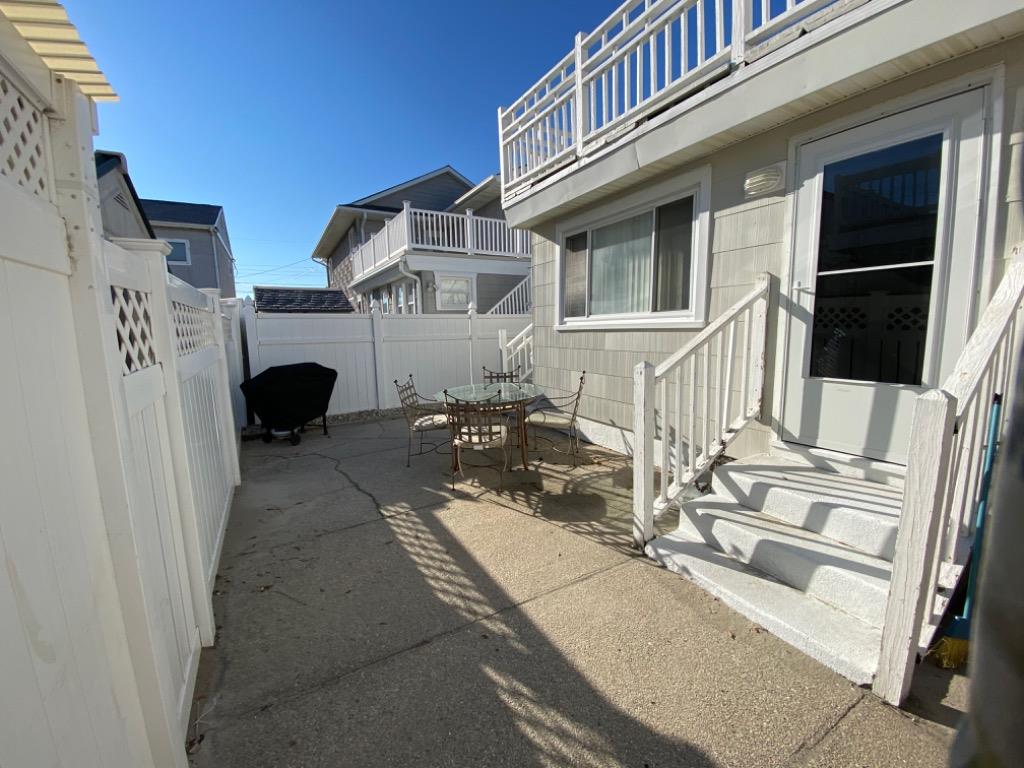 318 EAST HOLLYWOOD AVENUE  UNIT 2 - WILDWOOD CREST SUMMER VACATION RENTALS at WILDWOODRENTS.COM managed by ISLAND REALTY GROUP - Welcome to your perfect beachside getaway in Wildwood Crest! This charming property is ideal for a group of up to 6 guests, offering 2 bedrooms and 1 full bathroom for your comfort and convenience. As you step inside, you'll find a cozy and well-appointed living space with modern amenities to make your stay unforgettable. The living room features a comfortable sofa bed, perfect for relaxing after a day at the beach. Enjoy movie nights with the DVD player and streaming services on the smart TV. The kitchen is fully equipped with everything you need to whip up delicious meals, including a dishwasher, microwave, coffee maker, and toaster. The dining area is perfect for enjoying meals together with your loved ones. Both bedrooms are tastefully decorated and offer a peaceful retreat after a day of sun and sand. The first bedroom features a double bed, while the second bedroom has a twin bed with twin trundle for additional sleeping space. All beds come with mattress pads, pillows, and blankets for your comfort. Step outside to the deck and soak up the sun or enjoy a BBQ with friends and family. Take a refreshing dip in the outdoor pool or rinse off in the shared outdoor shower after a day at the beach. Additional amenities include central AC, ceiling fans, a washer and dryer, iron, ironing board, vacuum cleaner, high-speed internet, and smart TVs in each bedroom. Parking is a breeze with one designated parking space. This property is pet-friendly, so feel free to bring your furry friends along for the vacation. Please note that tenants are required to bring their own linens. Don't miss out on this fantastic opportunity to experience the best of Wildwood Crest! Book your stay today and create lasting memories in this beautiful beachside retreat. Wildwood Crest Rentals, North Wildwood Rentals, Wildwood Rentals and Diamond Beach Rentals in all price ranges for weekly, monthly, seasonal and weekend vacation rentals plus Wildwood real estate sales of homes, condos, vacation and investment properties in and around Wildwood New Jersey. We offer over 400 properties plus exclusive vacation homes so you can book the shore rental of your choice online and guarantee your vacation at the Shore. Rent with confidence at Island Realty Group! Visit www.wildwoodrents.com to book online or call our office at 609.522.4999. Our office at 1701 New Jersey Avenue in North Wildwood is open 7 days a week!