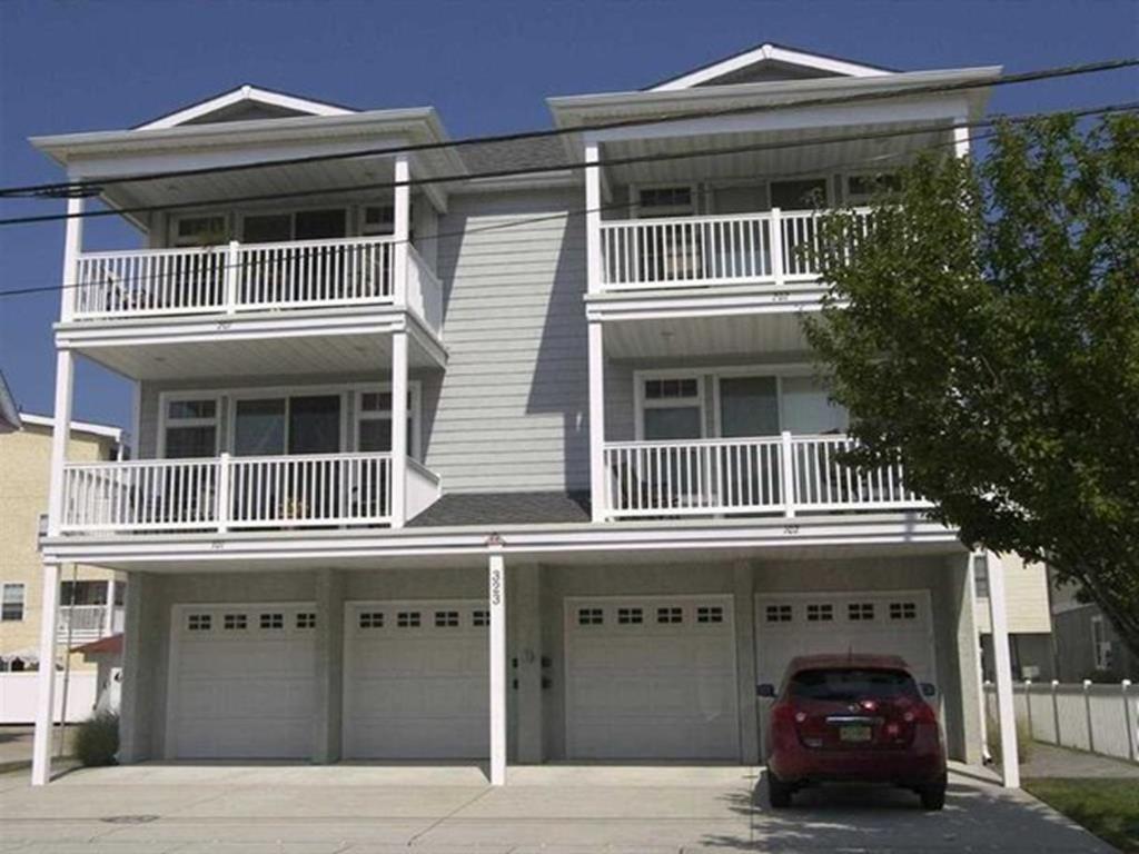 323 EAST 18TH AVENUE  UNIT 102 - NORTH WILDWOOD SUMMER VACATION RENTALS at WILDWOODRENTS.COM managed by ISLAND REALTY GROUP - This beautiful, almost new North Wildwood condo is located just 1 blocks from the beach. It is close to the boardwalk and family entertainment. With 3 bedrooms and 2 full baths, this condo would be perfect for your vacation. The condo features a large open floor plan with 9 foot ceilings. The property boasts of a great location and private 2 car off-street parking. Kitchen has fridge, icemaker, range, microwave, disposal, dishwasher, coffeemaker, toaster, and blender. Amenities include central a/c, washer/dryer, balcony, outside shower, one car off street parking, and wifi internet. Full kitchen offers fridge, range, dishwasher, toaster, disposal, coffeemaker, and microwave. Amenities include central a/c, washer/dryer, deck, outside shower and 2 car off street parking. Sleeps 10; 1 king, 1 queen, and 2 twin (bunk) and full, full sleep sofa. Once you park your car for the week, youll never have the need to move it! North Wildwood Rentals, Wildwood Rentals, Wildwood Crest Rentals and Diamond Beach Rentals in all price ranges for weekly, monthly, seasonal and weekend vacation rentals plus Wildwood real estate sales of homes, condos, vacation and investment properties in and around Wildwood New Jersey. We offer over 400 properties plus exclusive vacation homes so you can book the shore rental of your choice online and guarantee your vacation at the Shore. Rent with confidence at Island Realty Group! Visit www.wildwoodrents.com to book online or call our office at 609.522.4999. Our office at 1701 New Jersey Avenue in North Wildwood is open 7 days a week!