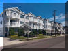 403 EAST 23rd  AVENUE  BEACHVIEW CONDOS UNIT B - NORTH WILDWOOD BEACHBLOCK SUMMER VACATION RENTALS at WILDWOODRENTS.COM - Beautiful Beach and Boardwalk Block Condo  The Sandy Shamrock! 3 bedrooms, 2 full bathrooms, 1500 sq ft, 2nd (top) floor, park-and-play vacation in North Wildwood! Steps away from Seaport Pier with views of Morey s Surfside Pier, Ocean Oasis Waterpark and Friday Night Fireworks! This clean, light and bright unit offers 2 off-street covered parking spaces, 4 flat screen cable TVs up to 65 inches (2 Roku with Netflix and Disney+), high-speed wi-fi, sleeps 10. Spacious, vaulted ceiling living area (seats 6) with bump out dining area and breakfast bar (seats 10). Enjoy sunrise coffee and sunset happy hours on the deck with bar height seating for 6. Bike over to the only skate park and hockey rink on the island! Walk 2 blocks to Hassles Ice Cream and Mini Golf off the boardwalk. Make a left and hit the free beach or boards (arcade and discount ticket store 500 feet away). Watch the Tram Car as you grab a slice, a cone, a Fractured Prune donut, some fudge and salt water taffy. Make a right and explore a full service playground with tennis courts, basketball courts, shuffleboard courts and picnic areas as well as an observation pier over the marshes. North Wildwood Rentals, Wildwood Rentals, Wildwood Crest Rentals and Diamond Beach Rentals in all price ranges for weekly, monthly, seasonal and weekend vacation rentals plus Wildwood real estate sales of homes, condos, vacation and investment properties in and around Wildwood New Jersey. We offer over 400 properties plus exclusive vacation homes so you can book the shore rental of your choice online and guarantee your vacation at the Shore. Rent with confidence at Island Realty Group! Visit www.wildwoodrents.com to book online or call our office at 609.522.4999. Our office at 1701 New Jersey Avenue in North Wildwood is open 7 days a week!