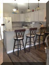 404 EAST 5TH AVENUE  CARIBBEAN CONDOS UNIT C - NORTH WILDWOOD SUMMER VACATION RENTALS at WILDWOODRENTS.COM managed by ISLAND REALTY GROUP, NORTH WILDWOOD REALTORS AND VACATION RENTAL MANAGEMENT -Welcome to your dream vacation rental in North Wildwood Beach Side! This stunning property is perfect for a group of up to 7 guests, offering 3 bedrooms and 2 full bathrooms for your comfort and convenience. As you step inside, you'll find a spacious and beautifully furnished living space with all the amenities you need for a relaxing stay. The kitchen is fully equipped with a dishwasher, microwave, disposal, coffee maker, toaster, blender, and more. Central AC and ceiling fans throughout the property ensure a comfortable temperature at all times. The sleeping arrangements include a luxurious king bed, a cozy queen bed, and a full/twin bunk, providing plenty of options for a good night's sleep. The property also features a washer, dryer, iron, ironing board, and vacuum cleaner for your convenience. Outside, you can enjoy the fresh air on the deck with deck furniture and an electric BBQ for outdoor cooking. The property also includes a 2-car garage for your vehicles. Additional amenities include 3 TVs with Firesticks, smart TV, high-speed internet, a lobster pot, food processor. Utilities are included, and cleaning is taken care of in the rate. This property is smoke-free and does not allow pets. Don't miss out on this fantastic vacation rental in North Wildwood! Book now and enjoy a memorable stay with your loved ones.  North Wildwood Rentals, Wildwood Rentals, Wildwood Crest Rentals and Diamond Beach Rentals in all price ranges for weekly, monthly, seasonal and weekend vacation rentals plus Wildwood real estate sales of homes, condos, vacation and investment properties in and around Wildwood New Jersey. We offer over 400 properties plus exclusive vacation homes so you can book the shore rental of your choice online and guarantee your vacation at the Shore. Rent with confidence at Island Realty Group! Visit www.wildwoodrents.com to book online or call our office at 609.522.4999. Our office at 1701 New Jersey Avenue in North Wildwood is open 7 days a week