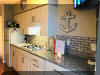 405 OCEAN AVENUE MEDITERRANEAN CONDOS UNIT 303 in NORTH WILDWOOD WITH POOL - Remodeled third floor unit with new kitchen cabinets, hardwood floors in living/dining area, bedroom with 2 double beds, like new bathroom PLUS heated pool and reserved parking....just a hop, skip and jump to beautiful North Wildwood FREE beaches. Sleeps 6; 2 full beds, queen sleep sofa. Kitchen had fridge, range, microwave, coffeemaker, toaster. North Wildwood Rentals, Wildwood Rentals, Wildwood Crest Rentals and Diamond Beach Rentals in all price ranges for weekly, monthly, seasonal and weekend vacation rentals plus Wildwood real estate sales of homes, condos, vacation and investment properties in and around Wildwood New Jersey. We offer over 400 properties plus exclusive vacation homes so you can book the shore rental of your choice online and guarantee your vacation at the Shore. Rent with confidence at Island Realty Group!