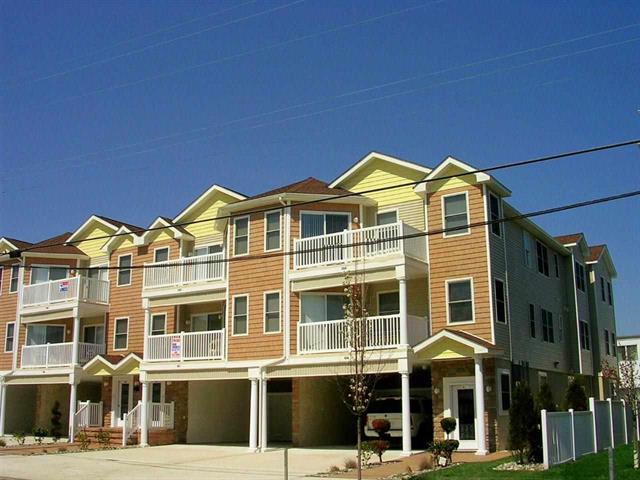 407 EAST 22ND AVENUE UNIT 201 - BEACHBLOCK IN NORTH WILDWOOD - Beach and boardwalk block! Three bedroom, two bath vacation home is just steps from our famous Beach and Boards! Home includes a fully equipped kitchen with range, fridge, disposal, microwave, coffeemaker, toaster and blender. Amenities include central a/c, washer/dryer, balcony, and three car off street parking. Sleeps 8: 1 Queen, 1 Double, 4 Singles