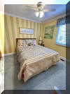 4101 OCEAN AVENUE  OLYMPUS CONDOS #2 - WILDWOOD BEACHBLOCK SUMMER VACATION RENTALS at WILDWOODRENTS.COM managed by ISLAND REALTY GROUP - Steps from the beach and boardwalk! This beach block property is perfect for a family of up to 7 guests, offering 2 bedrooms and 1 baths to ensure everyone's comfort during your stay. Friday night fireworks visible from the master bedroom balcony! As you step inside, you'll be greeted by a cozy living space featuring modern furnishings and a welcoming atmosphere. The fully equipped kitchen is complete with a dishwasher, microwave, coffee maker, toaster, blender, stove, full-size refrigerator, oven, and all the cooking utensils you need to whip up delicious meals. Enjoy your culinary creations at the dining table or head out to the deck to dine al fresco and soak up the sun. When it's time to rest, retreat to one of the two bedrooms, each furnished with a plush queen bed and equipped with a Smart TV for your viewing pleasure. Additional sleeping arrangements can be found in the queen sofa bed in the living room and the single sofa bed, ensuring that everyone has a comfortable place to lay their head. This property boasts modern amenities such as central AC, high-speed internet, a balcony, 2 car off street parking (1 garage/1 driveway). With the convenience of a washer, dryer, vacuum cleaner, and cleaning service included in the rate, you can focus on making lasting memories with your loved ones. Please note that this property is smoke-free and does not allow pets, ensuring a clean and allergy-friendly environment for all guests. Linens are not provided, so please remember to bring your own. Don't miss out on the opportunity to stay in this beautifully furnished vacation rental in Wildwood Beach Side. Book now and start planning your unforgettable getaway by the beach! Wildwood Rentals, North Wildwood Rentals, Wildwood Crest Rentals and Diamond Beach Rentals in all price ranges for weekly, monthly, seasonal and weekend vacation rentals plus Wildwood real estate sales of homes, condos, vacation and investment properties in and around Wildwood New Jersey. We offer over 400 properties plus exclusive vacation homes so you can book the shore rental of your choice online and guarantee your vacation at the Shore. Rent with confidence at Island Realty Group! Visit www.wildwoodrents.com to book online or call our office at 609.522.4999. Our office at 1701 New Jersey Avenue in North Wildwood is open 7 days a week!
