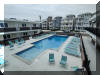415 EAST ATLANTA AVENUE – OCEANS 7 MARK 1 CONDOS #204 - WILDWOOD CREST BEACHBLOCK SUMMER VACATION RENTALS with POOLS at WILDWOODRENTS.COM - One bedroom, one bath condo located beach block in Wildwood Crest. Home offers a full kitchen with range, fridge, microwave, toaster and coffee maker. Sleeps 6, full in bedroom, full and full sleep sofa in living area. Amenities include pool, gas grill, balcony, coin-op washer/dryer, and one car off street parking. There are 2 smart televisions that can be utilized for free streaming apps or any apps that you can access via your account information. Cable service is not provided. Wildwood Crest Rentals, North Wildwood Rentals, Wildwood Rentals and Diamond Beach Rentals in all price ranges for weekly, monthly, seasonal and weekend vacation rentals plus Wildwood real estate sales of homes, condos, vacation and investment properties in and around Wildwood New Jersey. We offer over 400 properties plus exclusive vacation homes so you can book the shore rental of your choice online and guarantee your vacation at the Shore. Rent with confidence at Island Realty Group! Visit www.wildwoodrents.com to book online or call our office at 609.522.4999. Our office at 1701 New Jersey Avenue in North Wildwood is open 7 days a week!