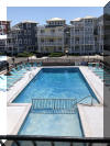 415 EAST ATLANTA AVENUE  OCEAN 7 CONDOS  #203 - WILDWOOD CREST BEACHBLOCK SUMMER VACATION RENTALS with POOLS at WILDWOODRENTS.COM managed by ISLAND REALTY GROUP, CREST WILDWOOD REALTORS AND VACATION RENTAL MANAGEMENT - Welcome to your cozy beachside retreat in Wildwood Crest! This charming property is perfect for a family of up to 4 guests, offering 1 double bed and a double sofa bed to ensure a comfortable stay. Located just steps away from the sandy shores of Wildwood Crest Beach, this studio-style unit features 1 full bathroom, a fully equipped kitchen with a microwave, coffee maker, toaster, stove, oven, and full-size refrigerator. The property also includes central AC, a washer and dryer, iron, and ironing board for your convenience. Enjoy the beautiful ocean views from your private balcony or relax by the outdoor pool on the deck with deck furniture provided. With high-speed internet and cable TV, you can stay connected and entertained during your stay. Parking is a breeze with 1 designated parking space available. This property is smoke-free and does not allow pets, ensuring a clean and comfortable environment for all guests. Experience a worry-free vacation with cleaning included in the rate, and all the essentials provided such as blankets, pillows, pots, pans, silverware, dinnerware, and cooking utensils. Don't miss out on this fantastic opportunity to stay in a fully furnished beachside property in Wildwood Crest. Book now and create unforgettable memories by the shore! Wildwood Crest Rentals, North Wildwood Rentals, Wildwood Rentals and Diamond Beach Rentals in all price ranges for weekly, monthly, seasonal and weekend vacation rentals plus Wildwood real estate sales of homes, condos, vacation and investment properties in and around Wildwood New Jersey. We offer over 400 properties plus exclusive vacation homes so you can book the shore rental of your choice online and guarantee your vacation at the Shore. Rent with confidence at Island Realty Group! Visit www.wildwoodrents.com to book online or call our office at 609.522.4999. Our office at 1701 New Jersey Avenue in North Wildwood is open 7 days a week!