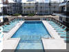 415 EAST ATLANTA AVENUE  OCEAN 7 CONDOS  #203 - WILDWOOD CREST BEACHBLOCK SUMMER VACATION RENTALS with POOLS at WILDWOODRENTS.COM managed by ISLAND REALTY GROUP, CREST WILDWOOD REALTORS AND VACATION RENTAL MANAGEMENT - Welcome to your cozy beachside retreat in Wildwood Crest! This charming property is perfect for a family of up to 4 guests, offering 1 double bed and a double sofa bed to ensure a comfortable stay. Located just steps away from the sandy shores of Wildwood Crest Beach, this studio-style unit features 1 full bathroom, a fully equipped kitchen with a microwave, coffee maker, toaster, stove, oven, and full-size refrigerator. The property also includes central AC, a washer and dryer, iron, and ironing board for your convenience. Enjoy the beautiful ocean views from your private balcony or relax by the outdoor pool on the deck with deck furniture provided. With high-speed internet and cable TV, you can stay connected and entertained during your stay. Parking is a breeze with 1 designated parking space available. This property is smoke-free and does not allow pets, ensuring a clean and comfortable environment for all guests. Experience a worry-free vacation with cleaning included in the rate, and all the essentials provided such as blankets, pillows, pots, pans, silverware, dinnerware, and cooking utensils. Don't miss out on this fantastic opportunity to stay in a fully furnished beachside property in Wildwood Crest. Book now and create unforgettable memories by the shore! Wildwood Crest Rentals, North Wildwood Rentals, Wildwood Rentals and Diamond Beach Rentals in all price ranges for weekly, monthly, seasonal and weekend vacation rentals plus Wildwood real estate sales of homes, condos, vacation and investment properties in and around Wildwood New Jersey. We offer over 400 properties plus exclusive vacation homes so you can book the shore rental of your choice online and guarantee your vacation at the Shore. Rent with confidence at Island Realty Group! Visit www.wildwoodrents.com to book online or call our office at 609.522.4999. Our office at 1701 New Jersey Avenue in North Wildwood is open 7 days a week!