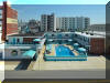 415 EAST ATLANTA AVENUE  OCEAN 7 CONDOS  #203 - WILDWOOD CREST BEACHBLOCK SUMMER VACATION RENTALS with POOLS at WILDWOODRENTS.COM managed by ISLAND REALTY GROUP, CREST WILDWOOD REALTORS AND VACATION RENTAL MANAGEMENT - Welcome to your cozy beachside retreat in Wildwood Crest! This charming property is perfect for a family of up to 4 guests, offering 1 double bed and a double sofa bed to ensure a comfortable stay. Located just steps away from the sandy shores of Wildwood Crest Beach, this studio-style unit features 1 full bathroom, a fully equipped kitchen with a microwave, coffee maker, toaster, stove, oven, and full-size refrigerator. The property also includes central AC, a washer and dryer, iron, and ironing board for your convenience. Enjoy the beautiful ocean views from your private balcony or relax by the outdoor pool on the deck with deck furniture provided. With high-speed internet and cable TV, you can stay connected and entertained during your stay. Parking is a breeze with 1 designated parking space available. This property is smoke-free and does not allow pets, ensuring a clean and comfortable environment for all guests. Experience a worry-free vacation with cleaning included in the rate, and all the essentials provided such as blankets, pillows, pots, pans, silverware, dinnerware, and cooking utensils. Don't miss out on this fantastic opportunity to stay in a fully furnished beachside property in Wildwood Crest. Book now and create unforgettable memories by the shore! Wildwood Crest Rentals, North Wildwood Rentals, Wildwood Rentals and Diamond Beach Rentals in all price ranges for weekly, monthly, seasonal and weekend vacation rentals plus Wildwood real estate sales of homes, condos, vacation and investment properties in and around Wildwood New Jersey. We offer over 400 properties plus exclusive vacation homes so you can book the shore rental of your choice online and guarantee your vacation at the Shore. Rent with confidence at Island Realty Group! Visit www.wildwoodrents.com to book online or call our office at 609.522.4999. Our office at 1701 New Jersey Avenue in North Wildwood is open 7 days a week!