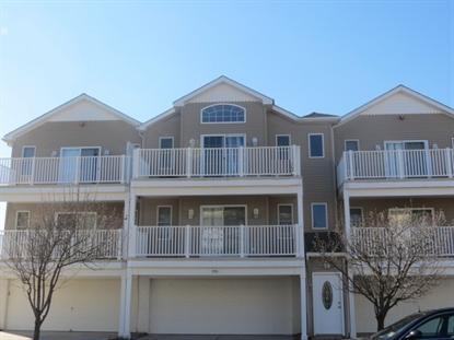 416 EAST 22ND AVENUE UNIT F - NORTH WILDWOOD RENTALS - Three bedroom, two bath vacation home located beach block in North Wildwood. Home has a full kitchen with range, fridge, disposal, dishwasher, microwave, coffeemaker and toaster. Amenities include outsider shower, balcony, 2 car off street parking, central a/c and washer/dryer. Sleeps 7: queen, full, and 3 twins. Wildwood Rentals, North Wildwood Rentals, Wildwood Crest Rentals and Diamond Beach Rentals in all price ranges for weekly, monthly, seasonal and weekend vacation rentals plus Wildwood real estate sales of homes, condos, vacation and investment properties in and around Wildwood New Jersey. We offer over 400 properties plus exclusive vacation homes so you can book the shore rental of your choice online and guarantee your vacation at the Shore. Rent with confidence at Island Realty Group!