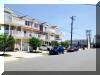 429 EAST 25TH AVENUE - BEACH REST CONDOMINIUMS UNIT 101 IN NORTH WILDWOOD - Five bedroom, three bath vacation home located steps from the beach and boardwalk in North Wildwood. First floor offers handicapped accessible living space. No steps to enter the unit. Use the handicapped ramp (as pictured) to enter the bottom level with 2 bedrooms plus BONUS family room. One of the ground level bedrooms also has its own bathroom with handicap accessible shower. There is a washer and dryer on this level for your private use on this level. The second floor offers an open kitchen, full hallway bath, 3 additional bedrooms, and dining/ living room with a queen sleeper sofa-bed. This area boasts a private patio (facing 25th Ave.) Enjoy a fully equipped kitchen with all appliances and amenities refrigerator/freezer, dishwasher, built-in microwave, self-cleaning oven, toaster, blender, coffee maker, dishes and glassware, pots, pans, etc. - Bedroom 1 Lower level Master suite- 1Queen and 1 twin bed with a private handicap accessible bathroom. (sleeps 3) - Bedroom 2 Lower level- 1 Queen poster bed. (sleeps 2) Upstairs bedrooms: - Master Bedroom: 1 King size bed with TV and private full-size bathroom -- (sleeps 2) The master bedroom also has a large walk-in closet.  - Bedroom 3: 1 Queen and 1 twin sized beds -- (sleeps 3) - Bedroom 4: 1 Full bed with 1 twin trundle (sleeps 3)  - Upper Family room has 2 pull out queen sofa beds for the flexible sleeping arrangement (sleeps 4) Amenities include central a/c, washer/dryer, wifi, balcony, and off street parking. North Wildwood Rentals, Wildwood Rentals, Wildwood Crest Rentals and Diamond Beach Rentals in all price ranges for weekly, monthly, seasonal and weekend vacation rentals plus Wildwood real estate sales of homes, condos, vacation and investment properties in and around Wildwood New Jersey. We offer over 400 properties plus exclusive vacation homes so you can book the shore rental of your choice online and guarantee your vacation at the Shore. Rent with confidence at Island Realty Group!