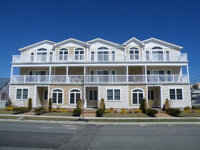 433 EAST 9TH AVENUE - UNIT 200 - NORTH WILDWOOD SUMMER VACTION RENTALS - Vacation home offers views of the beach from the side windows and from the large open deck. Just a hop, skip and jump to the beach. Four bedroom, two bath vacation home has a full kitchen with range, fridge, dishwasher, microwave, coffeemaker and toaster. Amenities include central a/c, wifi, 1 car off street parking, and washer/dryer. Additional space for bikes and beach carts and accessories. Sleeps 9; master: king / 2nd: queen / 3rd: 2 twin / 4th: twin bunk bed. North Wildwood Rentals, Wildwood Rentals, Wildwood Crest Rentals and Diamond Beach Rentals in all price ranges for weekly, monthly, seasonal and weekend vacation rentals plus Wildwood real estate sales of homes, condos, vacation and investment properties in and around Wildwood New Jersey. We offer over 400 properties plus exclusive vacation homes so you can book the shore rental of your choice online and guarantee your vacation at the Shore. Rent with confidence at Island Realty Group! Visit www.wildwoodrents.com to book online or call our office at 609.522.4999. Our office at 1701 New Jersey Avenue in North Wildwood is open 7 days a week!