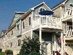 438 EAST 23RD AVENUE - NORTH WILDWOOD BEACHBLOCK TOWNHOUSE - Spacious townhouse steps from the North Wildwood Beach and Boardwalk! Four bedroom, three bath home offers views from most 2nd floor rooms. First floor is comprises of entry, two bedrooms and full bath. The second floor has living room, kitchen, dining, laundry, master bedroom, and 4th bedroom. Tastefully decorated and even offers a wet bar. Sleeps 10; king, queen, 4 twins, and queen sleep sofa. Amenities include central a/c, washer/dryer, tv s in all bedrooms, wifi, outside shower, balcony and 2 car off street parking (1 garage, 1 driveway)