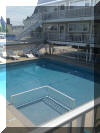 5001 NEW JERSEY AVENUE - HOLLY BEACH CONDOS #206 - WILDWOOD SUMMER VACATION RENTALS WITH POOLS - One bedroom, one bath condo located on the 2nd floor end. Condo has a kitchen with a range, fridge, microwave, toaster and coffee maker. Sleeps 4; 2 double beds and queen sleep sofa. Amenities include: wall a/c, pool, gas bbq, coin operated washer/dryer, one car off street parking. Wildwood Rentals, North Wildwood Rentals, Wildwood Crest Rentals and Diamond Beach Rentals in all price ranges for weekly, monthly, seasonal and weekend vacation rentals plus Wildwood real estate sales of homes, condos, vacation and investment properties in and around Wildwood New Jersey. We offer over 400 properties plus exclusive vacation homes so you can book the shore rental of your choice online and guarantee your vacation at the Shore. Rent with confidence at Island Realty Group!