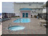 520 EAST STOCKTON ROAD  STOCKTON BEACH HOUSE #202 - WILDWOOD CREST BEACHFRONT SUMMER VACATION RENTALS with POOLS at WILDWOODRENTS.COM managed by ISLAND REALTY GROUP - Welcome to your dream vacation rental in Wildwood Crest! This stunning property can comfortably sleep up to 9 guests in its 3 bedrooms and 2.5 bathrooms. As you step inside, you'll be greeted by a beautifully furnished living space featuring 2 Queen Beds, 2 Single Beds, and a cozy Queen Sofa Bed, ensuring everyone has a comfortable place to rest after a day of beach fun. The property is equipped with modern amenities such as a dishwasher, microwave, coffee maker, and toaster, making meal preparation a breeze. Enjoy the convenience of central AC, ceiling fans, and gas heat to keep you comfortable year-round. Entertainment options abound with 4 TVs, cable TV, and high-speed internet. The outdoor pool is heated, perfect for a refreshing dip, and there's even a community hot tub for ultimate relaxation. Step outside to the deck and take in the fresh sea breeze while grilling up a feast on the gas BBQ. The rooftop deck offers panoramic views of the area, ideal for sunset cocktails. This property is pet-free and smoke-free, ensuring a clean and comfortable environment for all guests. Beach equipment, including chairs and umbrellas, is provided for your convenience. With 2 parking spaces, washer and dryer, and additional amenities like beach chairs, a crockpot, and Keurig coffee maker, this rental has everything you need for a memorable stay. Don't miss out on this fantastic opportunity to experience Wildwood Crest in style. Book now and start counting down the days to your beachside getaway! Wildwood Crest Rentals, North Wildwood Rentals, Wildwood Rentals and Diamond Beach Rentals in all price ranges for weekly, monthly, seasonal and weekend vacation rentals plus Wildwood real estate sales of homes, condos, vacation and investment properties in and around Wildwood New Jersey. We offer over 400 properties plus exclusive vacation homes so you can book the shore rental of your choice online and guarantee your vacation at the Shore. Rent with confidence at Island Realty Group! Visit www.wildwoodrents.com to book online or call our office at 609.522.4999. Our office at 1701 New Jersey Avenue in North Wildwood is open 7 days a week!