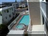 5501 ATLANTIC AVENUE - #207 - WILDWOOD CREST RENTALS AT THE MONARCH - Four bedroom two bath condominium is located at the very popular Monarch Condominiums in Wildwood Crest, which offers two pools/kiddie pools/hot tubs plus elevator service, all in a quiet area! Unit amenities include 4 bedrooms, 2 baths , central air conditioning, 5 TVs in the living room and all bedrooms, private washer and dryer, dishwasher, 2 car off street parking and private deck with furniture. Building amenities include a courtyard with 2 gas BBQ grills, common area with shaded benches, 2 hot tubs, 2 kiddie pools, 2 LARGE SWIMMING POOLS and more! This unit is renting on a weekly basis, and is non-smoking, no pets allowed. Book soon, available weeks at this unit won't last! 1 King, 2 Queens, 2 Singles and 1 Queen Sofa bed. Sleeps 10.  Wildwood Crest Rentals, North Wildwood Rentals, Wildwood Rentals and Diamond Beach Rentals in all price ranges for weekly, monthly, seasonal and weekend vacation rentals plus Wildwood real estate sales of homes, condos, vacation and investment properties in and around Wildwood New Jersey. We offer over 400 properties plus exclusive vacation homes so you can book the shore rental of your choice online and guarantee your vacation at the Shore. Rent with confidence at Island Realty Group!