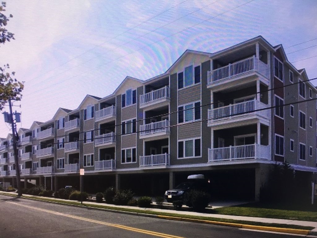 5501 ATLANTIC AVENUE - #207 - WILDWOOD CREST RENTALS AT THE MONARCH - Four bedroom two bath condominium is located at the very popular Monarch Condominiums in Wildwood Crest, which offers two pools/kiddie pools/hot tubs plus elevator service, all in a quiet area! Unit amenities include 4 bedrooms, 2 baths , central air conditioning, 5 TVs in the living room and all bedrooms, private washer and dryer, dishwasher, 2 car off street parking and private deck with furniture. Building amenities include a courtyard with 2 gas BBQ grills, common area with shaded benches, 2 hot tubs, 2 kiddie pools, 2 LARGE SWIMMING POOLS and more! This unit is renting on a weekly basis, and is non-smoking, no pets allowed. Book soon, available weeks at this unit won't last! 1 King, 2 Queens, 2 Singles and 1 Queen Sofa bed. Sleeps 10. Wildwood Crest Rentals, North Wildwood Rentals, Wildwood Rentals and Diamond Beach Rentals in all price ranges for weekly, monthly, seasonal and weekend vacation rentals plus Wildwood real estate sales of homes, condos, vacation and investment properties in and around Wildwood New Jersey. We offer over 400 properties plus exclusive vacation homes so you can book the shore rental of your choice online and guarantee your vacation at the Shore. Rent with confidence at Island Realty Group!