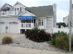DIAMOND BEACH SUMMER RENTAL at 207 EAST MADISON AVENUE - 3 Bedroom 2 Bath single family home located in one of the nicest spots at the South Jersey Shore. This lovely single family home offers privacy, multiple decks with amazing views of the intra-coastal waterway and wildlife reserve. This meticulously furnished home has cathedral ceilings and a spacious floor plan, large kitchen, Master bedroom and full bathroom on the first floor. Enjoy the amazing Sunset views right from the 2nd floor bedroom balcony. A fenced yard with outside shower and BBQ. Take a short stroll to the private access beach with entertainment, and within walking distance to miniature golf, restaurants and shopping. Hop on the trolley to the boardwalk or take a short car ride over the bridge to Cape May. Sleeps 8.