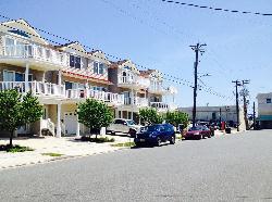 429 EAST 25TH AVENUE - BEACH REST CONDOMINIUMS UNIT 101 IN NORTH WILDWOOD - Five bedroom, three bath vacation home located steps from the beach and boardwalk in North Wildwood. First floor offers handicapped accessible living space. No steps to enter the unit. Use the handicapped ramp (as pictured) to enter the bottom level with 2 bedrooms plus BONUS family room. One of the ground level bedrooms also has its own bathroom with handicap accessible shower. There is a washer and dryer on this level for your private use on this level. The second floor offers an open kitchen, full hallway bath, 3 additional bedrooms, and dining/ living room with a queen sleeper sofa-bed. This area boasts a private patio (facing 25th Ave.) Enjoy a fully equipped kitchen with all appliances and amenities refrigerator/freezer, dishwasher, built-in microwave, self-cleaning oven, toaster, blender, coffee maker, dishes and glassware, pots, pans, etc. - Bedroom 1 Lower level Master suite- 1Queen and 1 twin bed with a private handicap accessible bathroom. (sleeps 3) - Bedroom 2 Lower level- 1 Queen poster bed. (sleeps 2) Upstairs bedrooms: - Master Bedroom: 1 King size bed with TV and private full-size bathroom -- (sleeps 2) The master bedroom also has a large walk-in closet.  - Bedroom 3: 1 Queen and 1 twin sized beds -- (sleeps 3) - Bedroom 4: 1 Full bed with 1 twin trundle (sleeps 3)  - Upper Family room has 2 pull out queen sofa beds for the flexible sleeping arrangement (sleeps 4) Amenities include central a/c, washer/dryer, wifi, balcony, and off street parking. North Wildwood Rentals, Wildwood Rentals, Wildwood Crest Rentals and Diamond Beach Rentals in all price ranges for weekly, monthly, seasonal and weekend vacation rentals plus Wildwood real estate sales of homes, condos, vacation and investment properties in and around Wildwood New Jersey. We offer over 400 properties plus exclusive vacation homes so you can book the shore rental of your choice online and guarantee your vacation at the Shore. Rent with confidence at Island Realty Group!